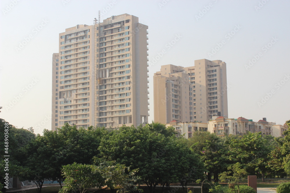 A picture of residential building with sky background