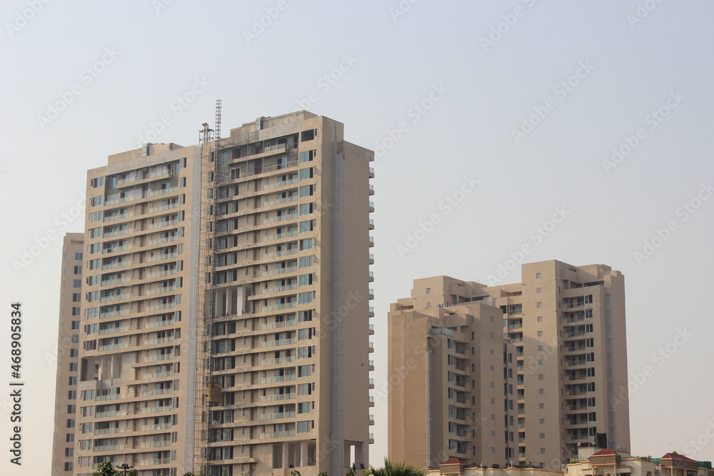 A picture of residential building with sky background