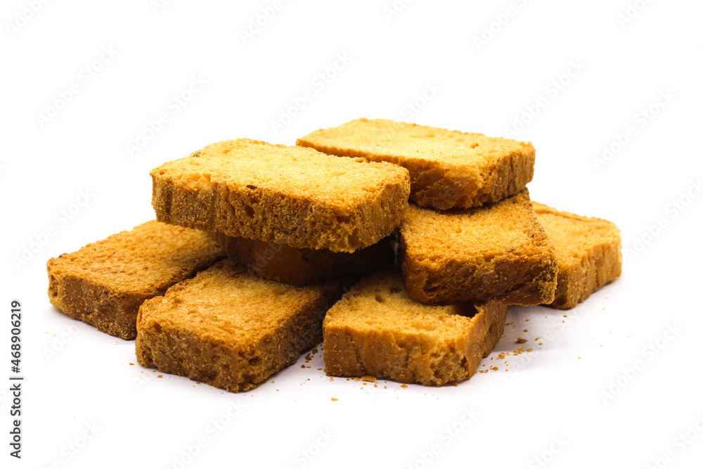 Crispy rusk on white background with selective focus Crispy rusk on white background with selective focus
