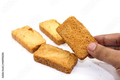 Crispy rusk on white background with selective focus