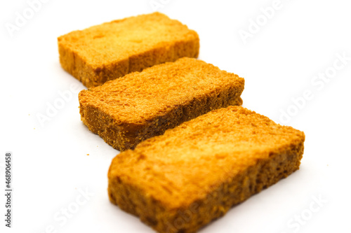 Crispy rusk on white background with selective focus