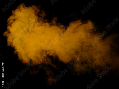 Yellow smoke texture on black background