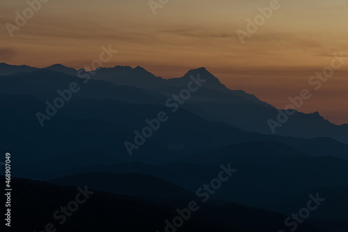 sunset over the corsican mountains near saint florent ,corsica France , soft layered misty colours ,with copy space . photo