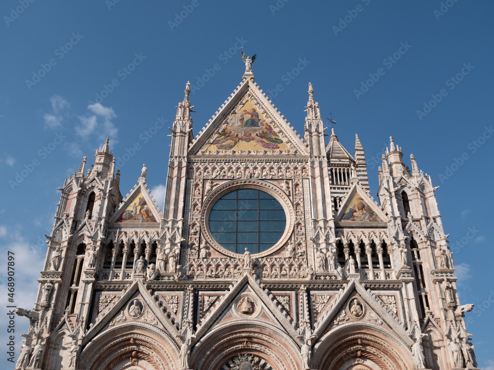 Duomo di Siena Cathedral West Facade in Tuscany, Italy also called Cattedrale Metropolitana di Santa Maria Assunta