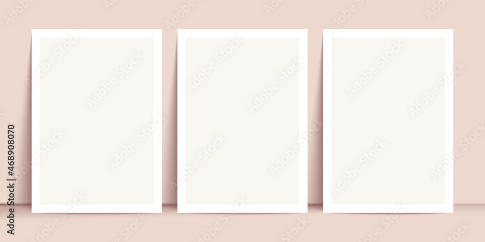 White posters mockup standing on the floor near beige wall. Blank Canvas Mockup for design White posters mockup standing on the floor near beige wall. Blank Canvas Mockup for design