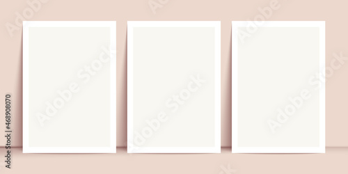 White posters mockup standing on the floor near beige wall. Blank Canvas Mockup for design