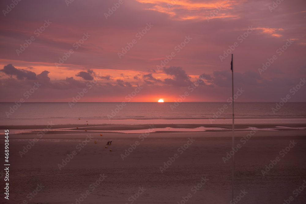 Sunset on a beach by the sea Sunset on a beach by the sea