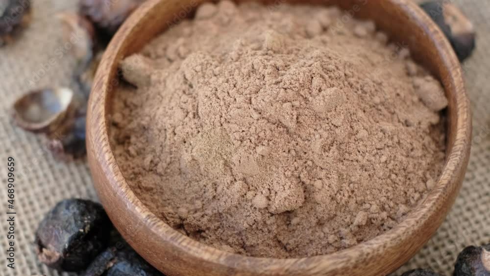 Stockvideon pile of ground soap nut powder for ecological washing. The