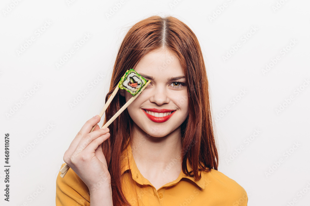 pretty woman eating sushi chopsticks light background pretty woman eating sushi chopsticks light background