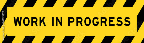 Yellow and black color with line striped label banner with word work in progress