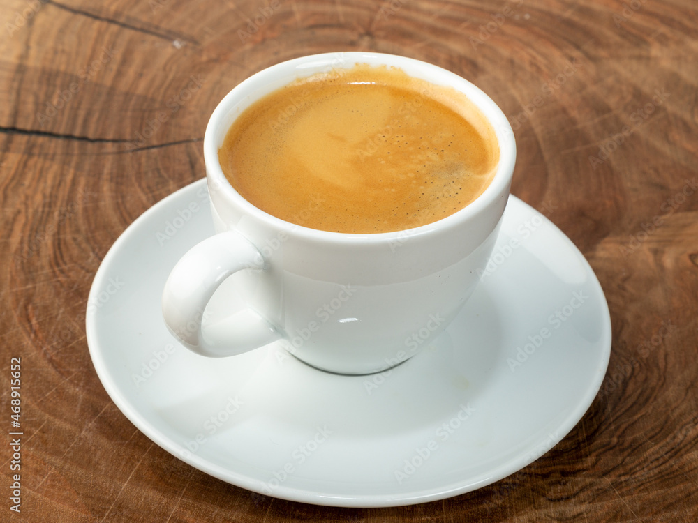 coffee in white cup with wood background coffee in white cup with wood background