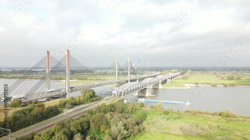 Dr. W. Hupkesbrug and Martinus Nijhoffbrug aerial drone view highway infrastructure bridge over a large waterway in The Netherlands. Zaltbommel photo