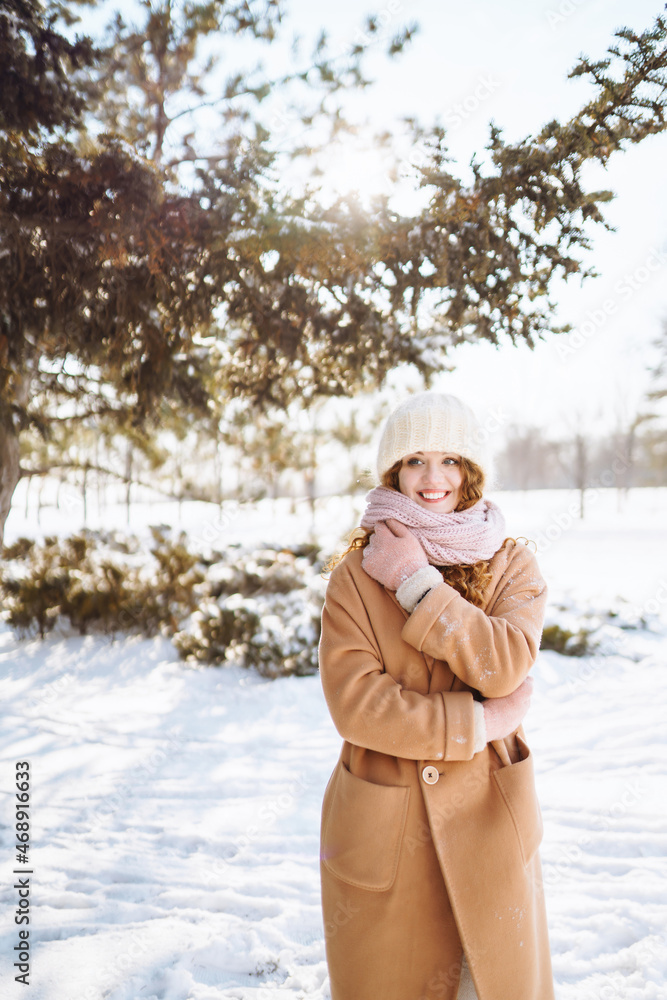 Happy woman walking in the snowy winter day outdoor. Winter fashion, holidays, rest, travel concept. Happy woman walking in the snowy winter day outdoor. Winter fashion, holidays, rest, travel concept.