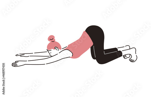 ヨガをする女性猫のポーズ