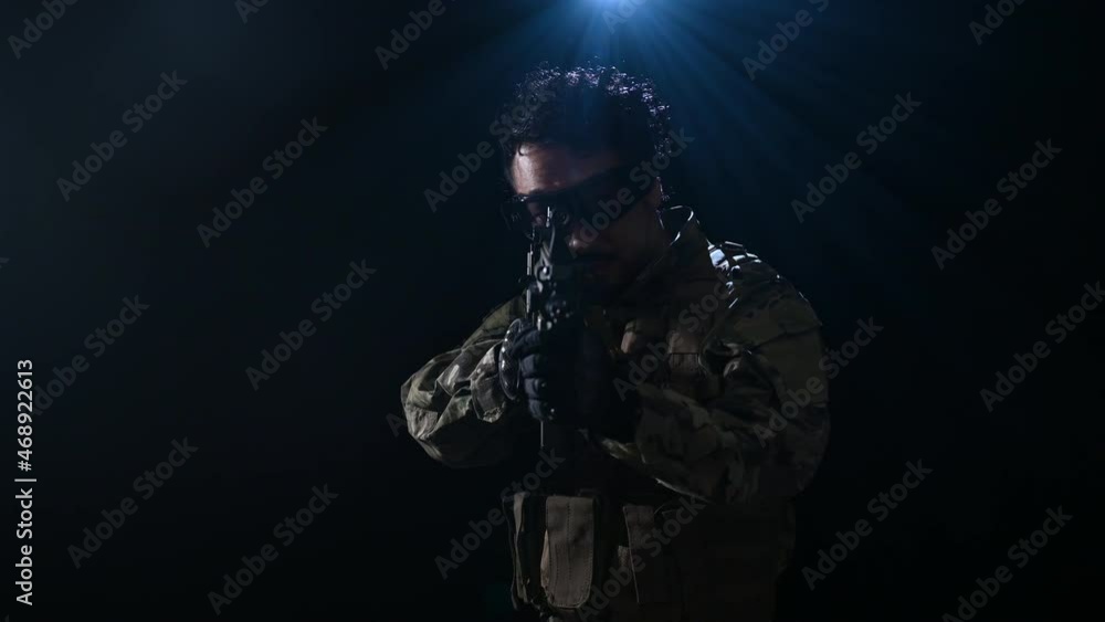 A strong, military-looking man taking aim video A strong, military-looking man taking aim video
