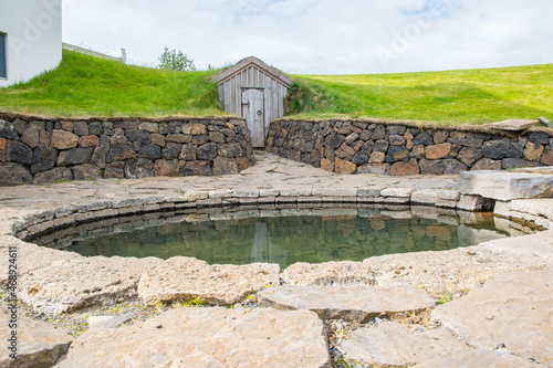 Snorralaug hot spring in village of Reykholt in Borgarfjordur in Iceland photo