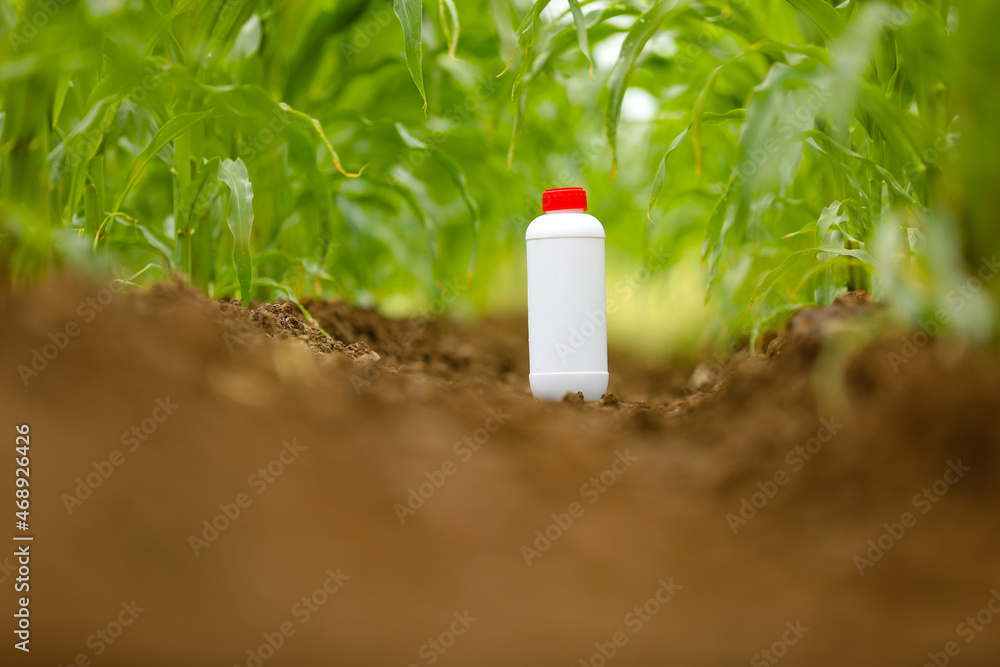 Protection of crops from pests and diseases. pesticide bottle at ...