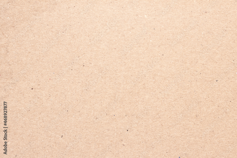 A sheet of brown cardboard. Paper natural texture. A sheet of brown cardboard. Paper natural texture.