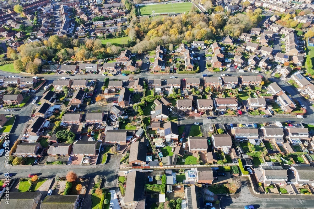 Aerial view of traditional housing estate in England. Looking down birds eye, like a miniature village. Estate agent.