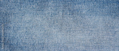 Photo High detailed photo of blue jeans fabric, classic denim background, texture
