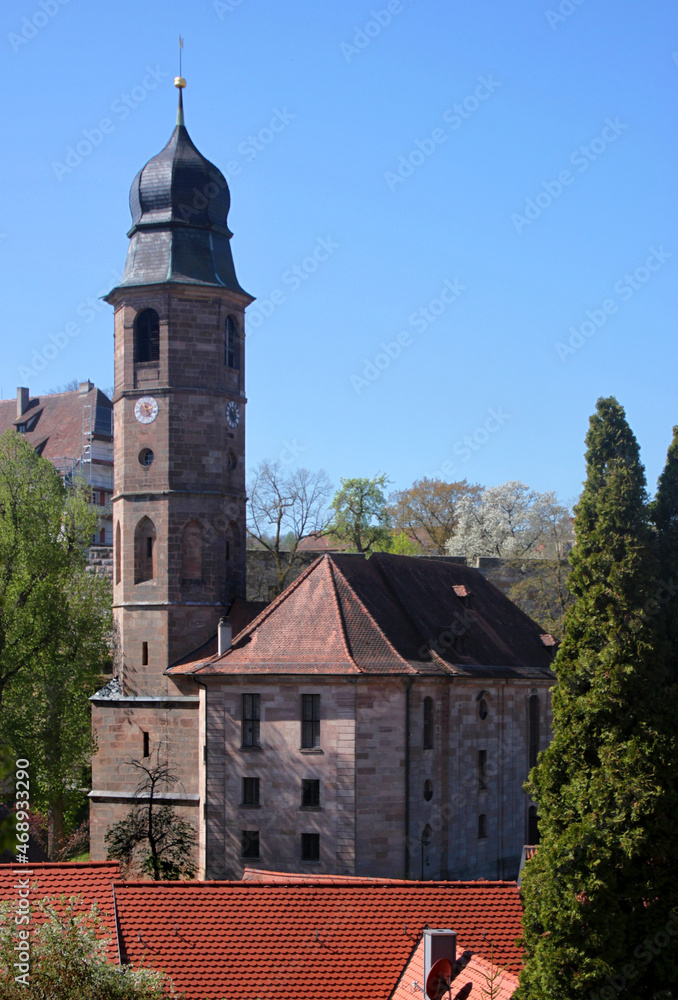 Fototapeta premium Baroque city church with its gothic bell tower in the old town of Cadolzburg, Franken region in Germany
