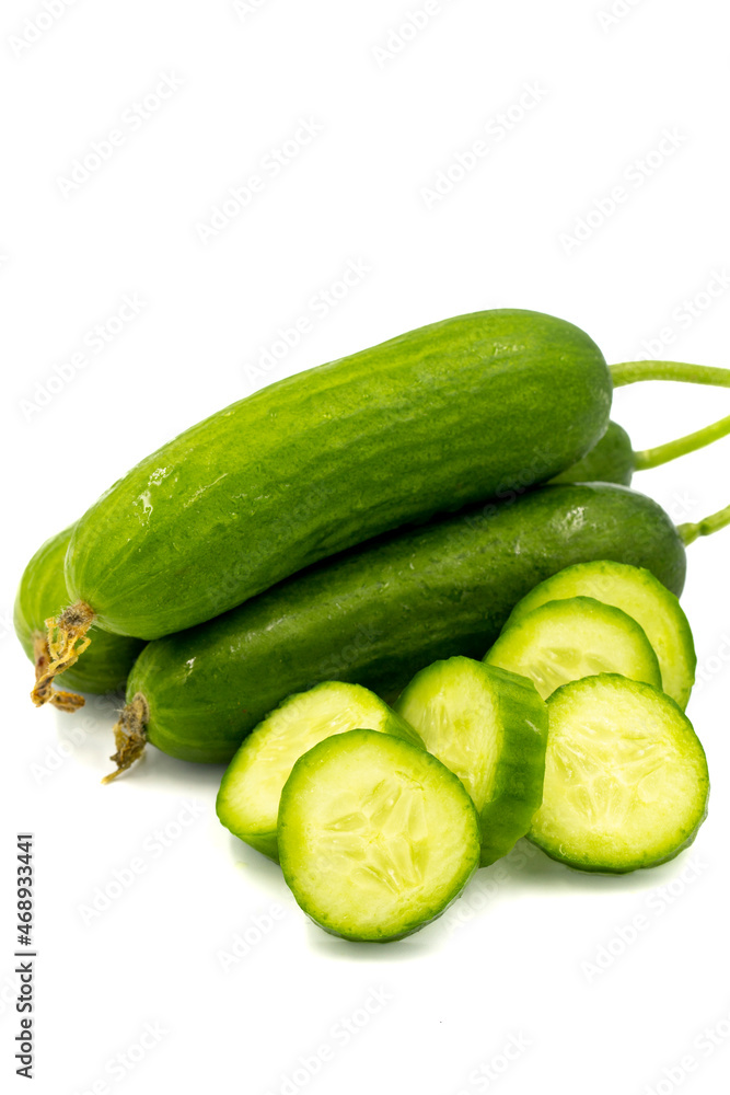 Ripe cucumbers on a white background. Close-up sliced cucumber. Story format Ripe cucumbers on a white background. Close-up sliced cucumber. Story format