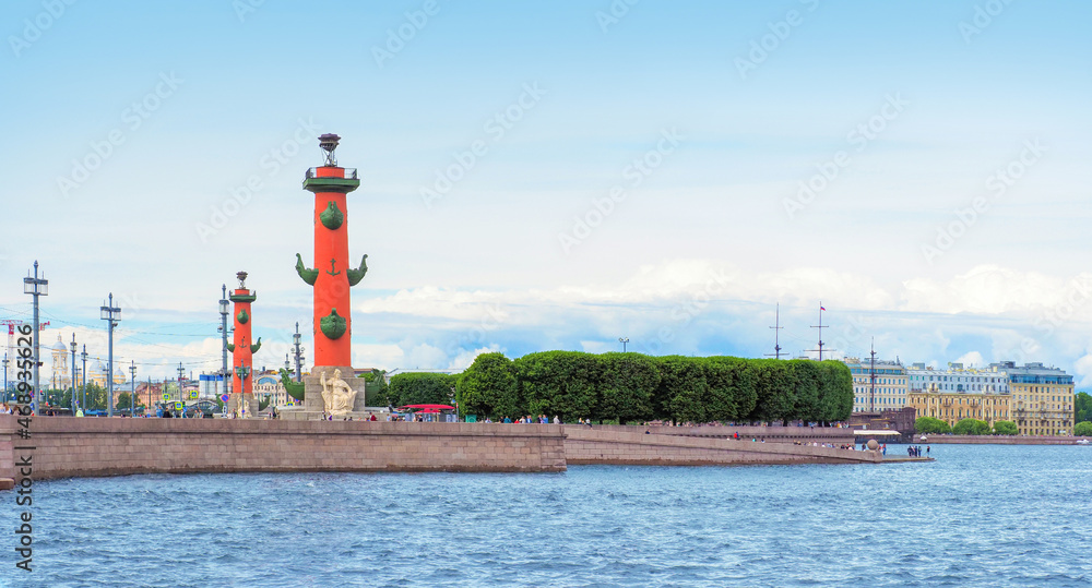 Rostral columns at Vasilievsky island, St Petersburg, Russia. View of Vasilievsky island from Neva River