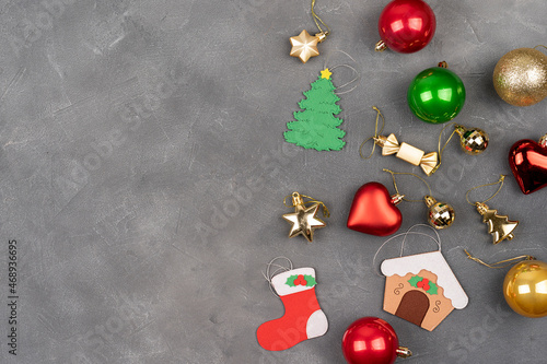 Christmas banner. Gray Xmas background with golden and red balls, garland. Christmas frame,