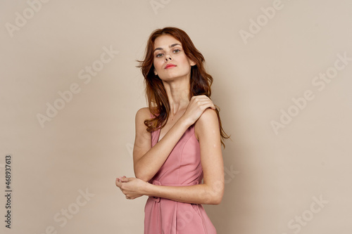 woman in pink dress glamor posing model isolated background © VICHIZH