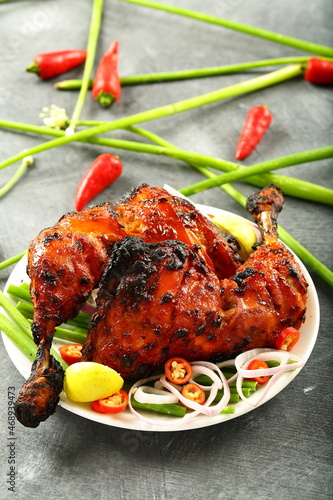 Homemade Indian tandoor cooking- tandoori chicken with vegetable salads. 