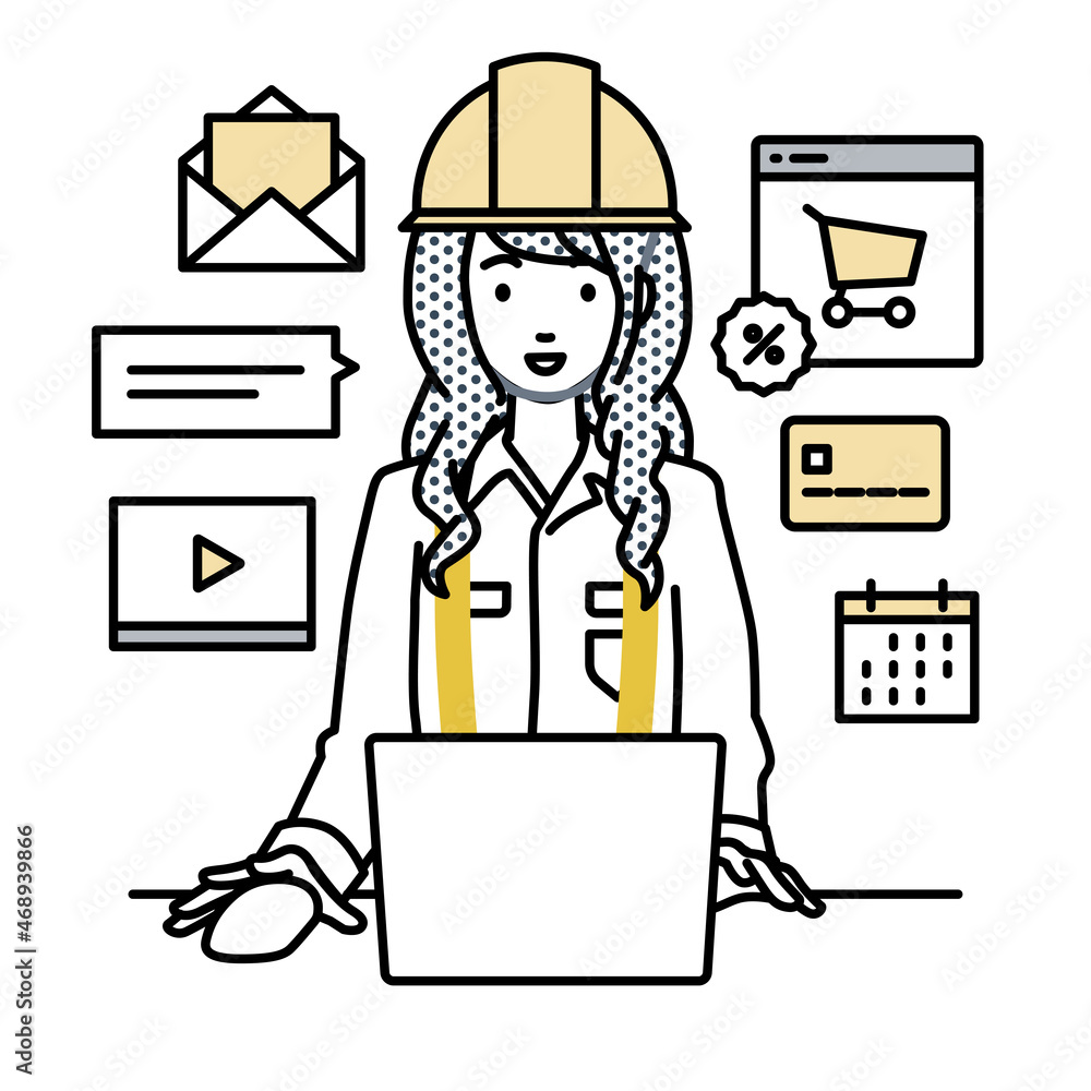 デスクで座ってPCでネットショップやマーケティングの仕事をしている工事現場の女性