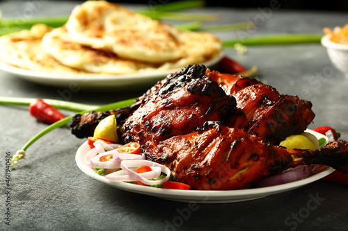 Traditional recipes- Indian tandoori chicken, marinated with spices and herbs. photo