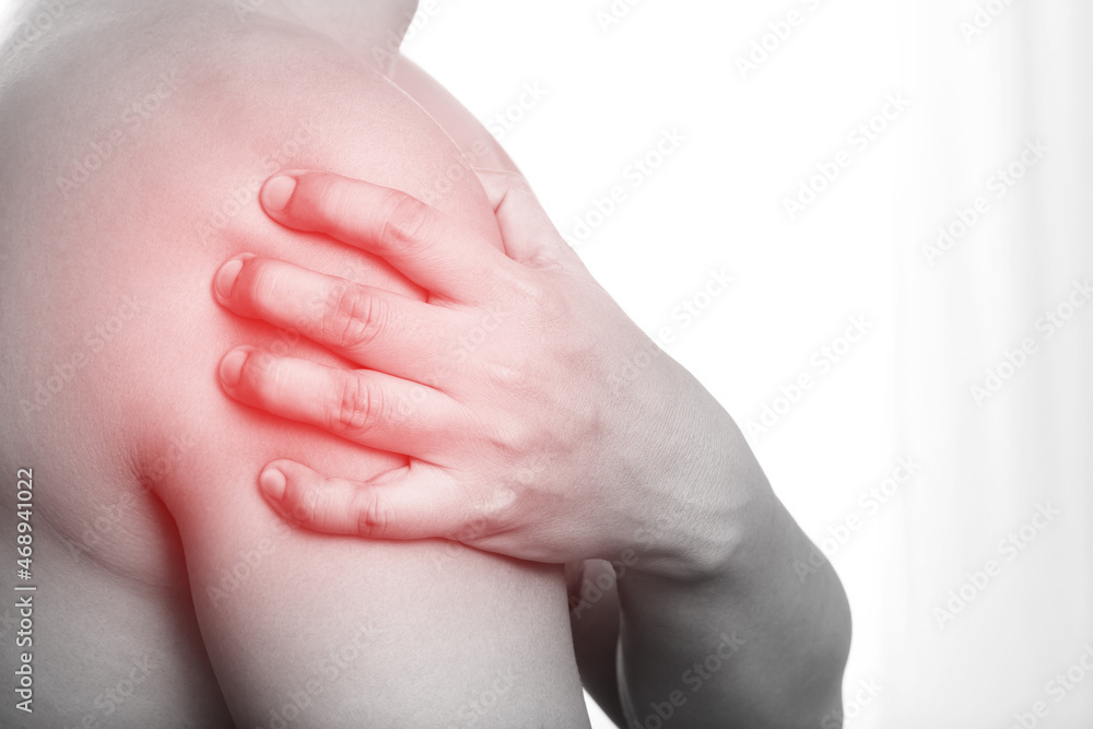 young man touching painful twisted or broken shoulder. Athlete training accident. Sport Exercise is not warm, causing injury. and pain with arm bones. Health care concept. young man touching painful twisted or broken shoulder. Athlete training accident. Sport Exercise is not warm, causing injury. and pain with arm bones. Health care concept.