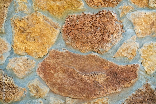 Background of stone wall texture. Yellow stone.