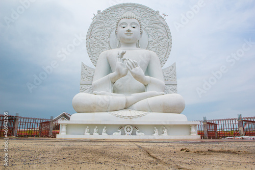 Closeup the Buddha white sit down isolated on white