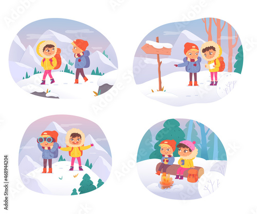 Children in winter adventure, hiking to mountain camp, little boy, girl with backpacks