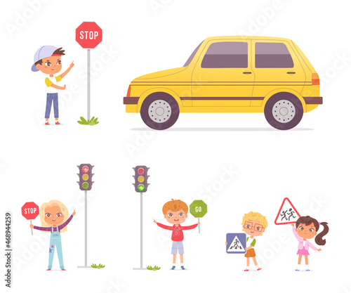 Group of preschool children studying traffic rules, holding road signs in their hands, traffic without stopping is prohibited, attention crossing the road at permitting traffic light