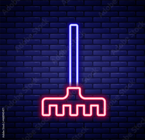 Glowing neon line Garden rake icon isolated on brick wall background. Tool for horticulture, agriculture, farming. Ground cultivator. Housekeeping equipment. Colorful outline concept. Vector