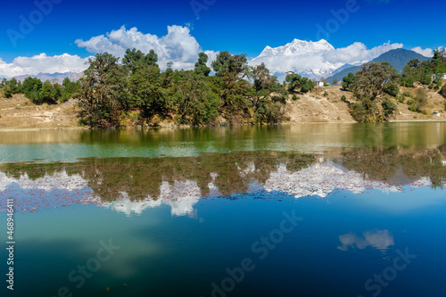 Deoria Tal , also Devaria or Deoriya is a high altitude lake in Uttarakhand, India. Blue sky with snow-covered mountains, Chaukhamba is one of them, in the background. © mitrarudra