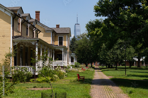 Photography Row of Old Yellow Wooden Homes on Governors Island during the Summer in New York