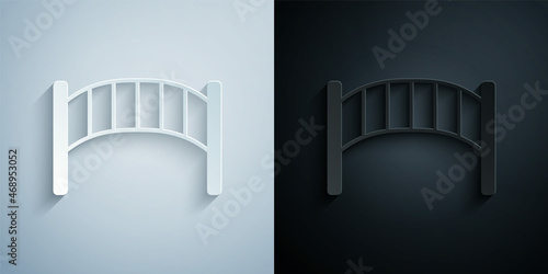 Paper cut Playground kids bridge icon isolated on grey and black background. Paper art style. Vector
