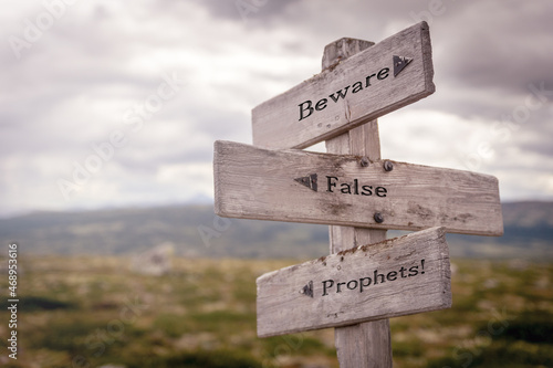 beware false prophets text on wooden sign outdoors in nature. Religious and christianity quotes. photo