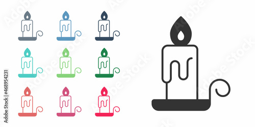 Black Burning candle in candlestick icon isolated on white background. Cylindrical candle stick with burning flame. Set icons colorful. Vector