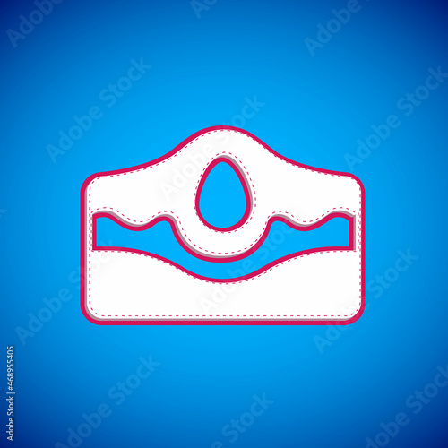 White Acne icon isolated on blue background. Inflamed pimple on the skin. The sebum in the clogged pore promotes the growth of a bacteria. Vector