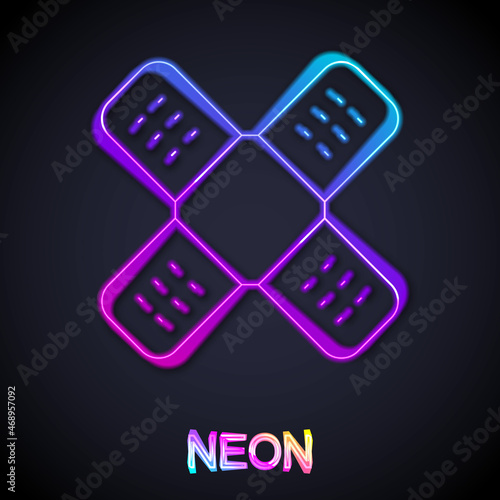 Glowing neon line Crossed bandage plaster icon isolated on black background. Medical plaster, adhesive bandage, flexible fabric bandage. Vector