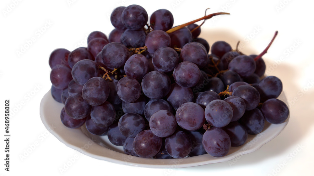 Grapes on a white plate on a white background Grapes on a white plate on a white background