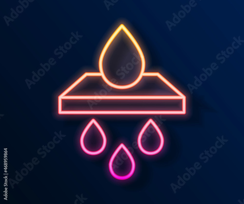 Glowing neon line Water filter cartridge icon isolated on black background. Vector