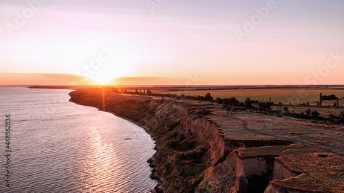 Shot of cape Ajiyaks during sunset. Summer sea at sunset. Rybakowka, Ukraine photo