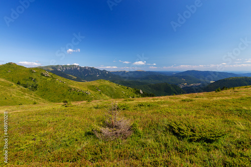 Green plateau in Ciucas mountain in Romania on a beautiful summer day © oliverleicher