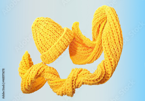 flying levitating scarf and hat. knitted winter woman yellow accessories. creative shot of warm apparel for autumn